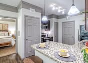 Thumbnail 5 of 47 - Modern Kitchen at Avenues at Shadow Creek Ranch Apartments, Pearland, TX