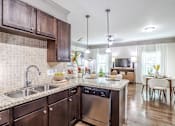 Thumbnail 3 of 47 - Specious Kitchen at Avenues at Shadow Creek Ranch Apartments, Pearland, Texas