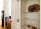Thumbnail 16 of 57 - A kitchen with a stove and a hat on the shelf. at CityView, North Kansas City, Missouri