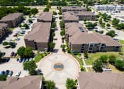 Thumbnail 43 of 43 - an aerial view of a neighborhood with houses and buildings and a circle in the middle at Discovery at Craig Ranch, McKinney, 75070