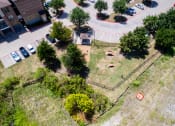 Thumbnail 41 of 43 - an aerial view of a yard with trees and a parking lot at Discovery at Craig Ranch, McKinney, TX, 75070