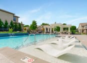 Thumbnail 38 of 46 - Pool Side Relaxing Area With Sundeck at Prairie Pines Townhomes, Kansas
