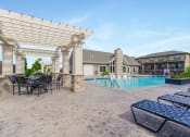 Thumbnail 34 of 46 - Poolside Relaxing Area at Prairie Pines Townhomes, Shawnee, KS