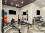 Thumbnail 6 of 49 - Fitness Center With Yoga/Stretch Area at Discovery at Kingwood, Kingwood, TX, 77339