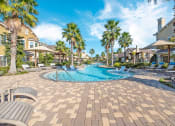 Thumbnail 18 of 45 - Lounging By The Pool at Avenues at Tuscan Lakes, League City, Texas