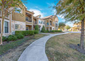 Thumbnail 28 of 45 - Walking Path In Courtyard at Avenues at Tuscan Lakes, League City, Texas