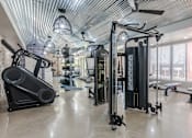 Thumbnail 19 of 100 - Gym with a Rowing Machine at Edge 35 Apartments, Indiana, 46203