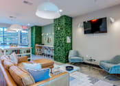 Thumbnail 14 of 100 - Living Room with a Green Wall at Edge 35 Apartments, Indiana