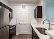 Thumbnail 27 of 47 - Modern Kitchen at Grand Villas at Cinco Ranch, Katy