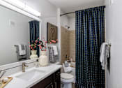 Thumbnail 16 of 47 - Bathroom with shower and curtain at Grand Villas at Cinco Ranch, Katy, 77494