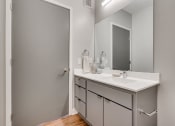 Thumbnail 10 of 65 - a bathroom with a sink and a mirror at Marquee, Minneapolis, MN