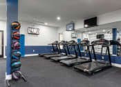 Thumbnail 35 of 61 - treadmills in fitness center at The Greyson, Hilliard, OH, 43026