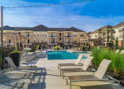 Thumbnail 2 of 61 - pool with lounge chairs on sundeck  at The Greyson, Hilliard, Ohio