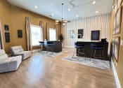 Thumbnail 5 of 38 - a living room with a couch and a bar at Waterstone at Cinco Ranch, Katy, TX, 77450