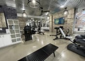 Thumbnail 24 of 63 - the gym has a lot of equipment and a tv at Edge 35, Indianapolis