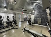 Thumbnail 20 of 63 - a workout room with weights and chairs and a chalkboard wall in a gym at Edge 35, Indianapolis