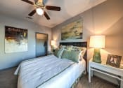 Thumbnail 37 of 38 - a bedroom with a bed and a ceiling fan at Waterstone at Cinco Ranch, Katy, TX, 77450