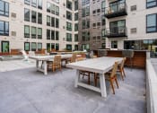 Thumbnail 20 of 65 - Outdoor Dining Tables and Entertainment Space at Marquee, Minneapolis, MN