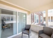 Thumbnail 21 of 27 - a living room with two chairs and a large window  at Butternut Ridge, North Olmsted, 44070
