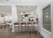 Thumbnail 26 of 27 - a kitchen with a bar and stools in a living room  at Butternut Ridge, Ohio, 44070