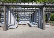 Thumbnail 14 of 27 - a group of lounge chairs under a pergola  at Butternut Ridge, North Olmsted, OH, 44070