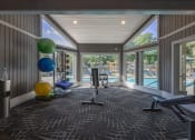 Thumbnail 19 of 27 - a gym with windows and a view of a pool  at Butternut Ridge, Ohio