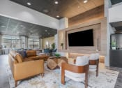 Thumbnail 3 of 28 - a living room with a couch and a television at CityView, North Kansas City, MO