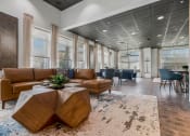 Thumbnail 1 of 28 - a lobby with couches and a table on a rug at CityView, Missouri, 64116