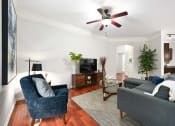 Thumbnail 6 of 39 - a living room with two couches and a ceiling fan at Sovereign at Overland Park, Kansas