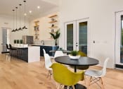 Thumbnail 22 of 39 - a kitchen and dining area with a table and chairs at Sovereign at Overland Park, Overland Park, 66213