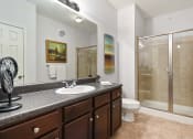 Thumbnail 13 of 39 - a bathroom with a sink and a shower and a toilet at Sovereign at Overland Park, Overland Park
