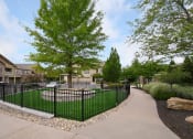 Thumbnail 31 of 39 - the view of a yard with a wrought iron fence at Sovereign at Overland Park, Overland Park, 66213