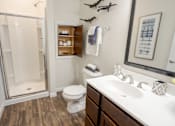 Thumbnail 6 of 62 - A bathroom with a toilet, sink, and a shower. at Overland Park, Pickerington, 43147
