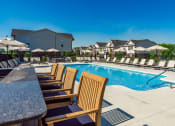 Thumbnail 3 of 64 - bar with chairs next to pool at Overland Park, Ohio