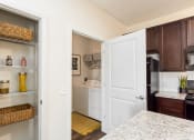 Thumbnail 41 of 64 - kitchen with view of laundry area at Overland Park, Pickerington, OH