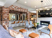 Thumbnail 30 of 59 - Resident Lounge With TV And Fireplace at Penn Circle, Carmel, IN, 46032