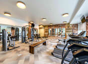 Thumbnail 23 of 59 - A gym with treadmills, weights, and exercise equipment. at Penn Circle, Indiana, 46032
