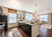 Thumbnail 3 of 59 - Kitchen And Living Area at Penn Circle, Carmel, Indiana