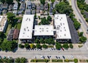 Thumbnail 81 of 94 - A parking lot with cars and a building in the background. at Pinnex, Indianapolis, 46203