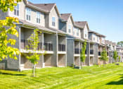Thumbnail 45 of 46 - back exterior of townhomes with lawn at Prairie Pines Townhomes, Kansas