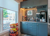 Thumbnail 42 of 63 - A kitchen with a Starbucks sign on the wall.