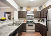 Thumbnail 1 of 38 - fully equipped kitchen with stainless steel appliances at River Pointe, Conroe, Texas