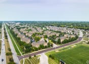 Thumbnail 39 of 39 - an aerial view of a neighborhood of houses and a highway at Sovereign at Overland Park, Overland Park