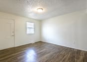 Thumbnail 7 of 43 - A room with wooden flooring and a window at Spring Creek Townhomes Apartments, Springfield 62702
