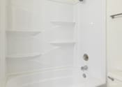Thumbnail 10 of 43 - A white bathroom cabinet with shelves and a towel bar at Spring Creek Townhomes Apartments, Illinois