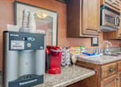 Thumbnail 27 of 46 - Kitchen with UV light sterilizer at Springhill Apartments, Kansas