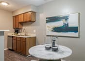 Thumbnail 4 of 46 - Kitchen and Dining at Springhill Apartments, Overland Park, KS