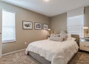 Thumbnail 8 of 46 - Bedroom with Large Bed at Springhill Apartments, Kansas
