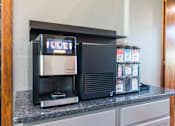 Thumbnail 2 of 42 - A coffee machine is on a counter with a display showing the word "coffee".
