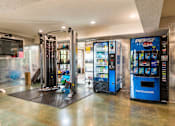 Thumbnail 12 of 42 - A Pepsi vending machine is in a room with a black mat on the floor.